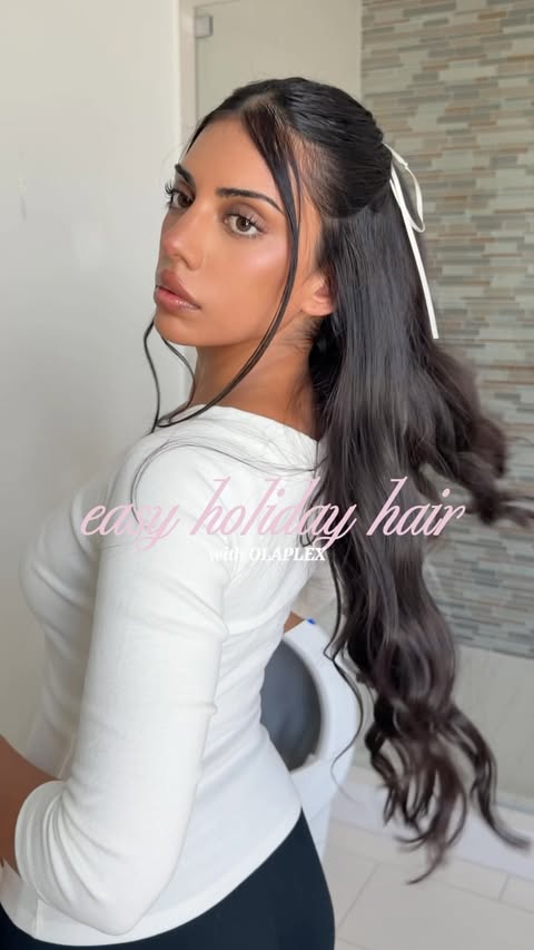 Instagram post by @sanagilani for OLAPLEX. Caption reads: holiday hair inspo 🤍 🎀 @olaplex #OLAPLEXpartner.