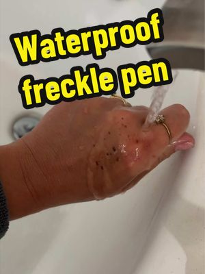TikTok post by @fakehair_dntcare for Babygodewy Beauty. Caption reads: @babygodewybeauty this freckle pen is waterproof!....