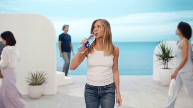 Instagram post by @jennifeeraniiston for SmartWater. Caption reads: NEW • @jenniferaniston for @smartwater....