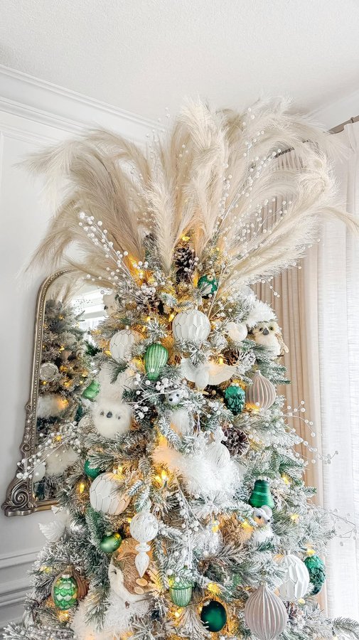 Instagram post by @chandeliers.and.champagne for The Bay. Caption reads: When the tree topper has a personality....