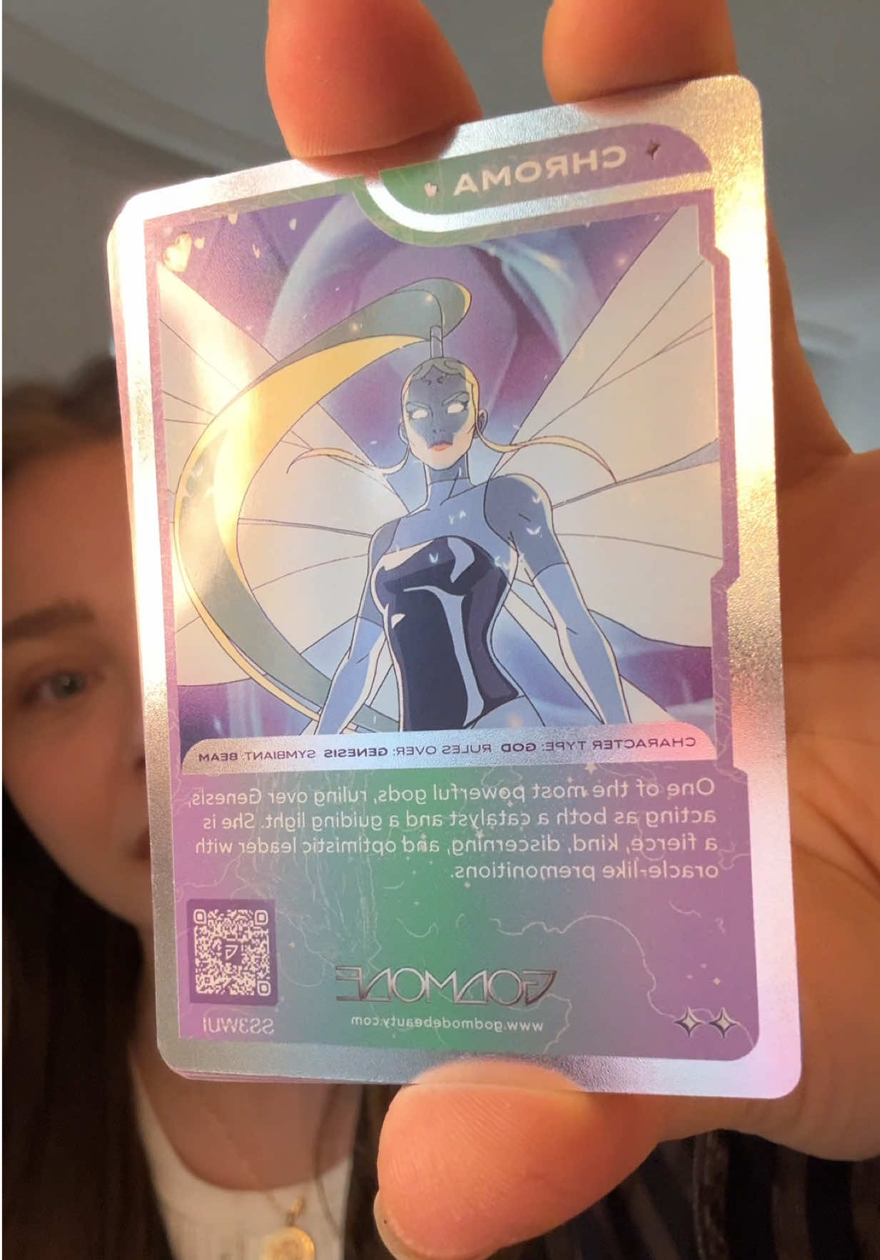 TikTok post by @chloegmoretz for Godmode Beauty. Caption reads: [...] card unlocks GEMS in the alliance @GODMODE....