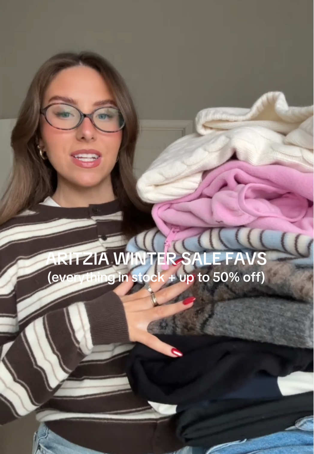 TikTok post by @emilygrace.26 for Aritzia. Caption reads: [...] in stock & up to 50% off (🔗 on ShopMy)....