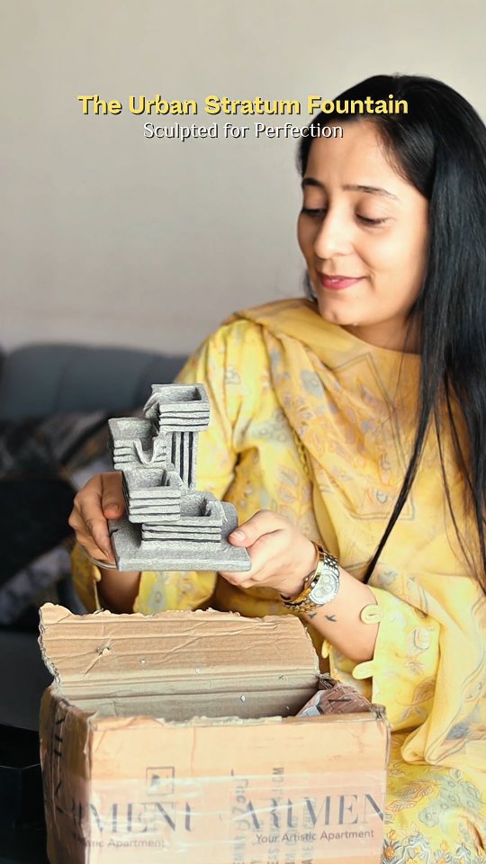 Instagram post by @tiny_cuddles25 for The Artment. Caption reads: Bring the calmness of The Artment’s waterfall....