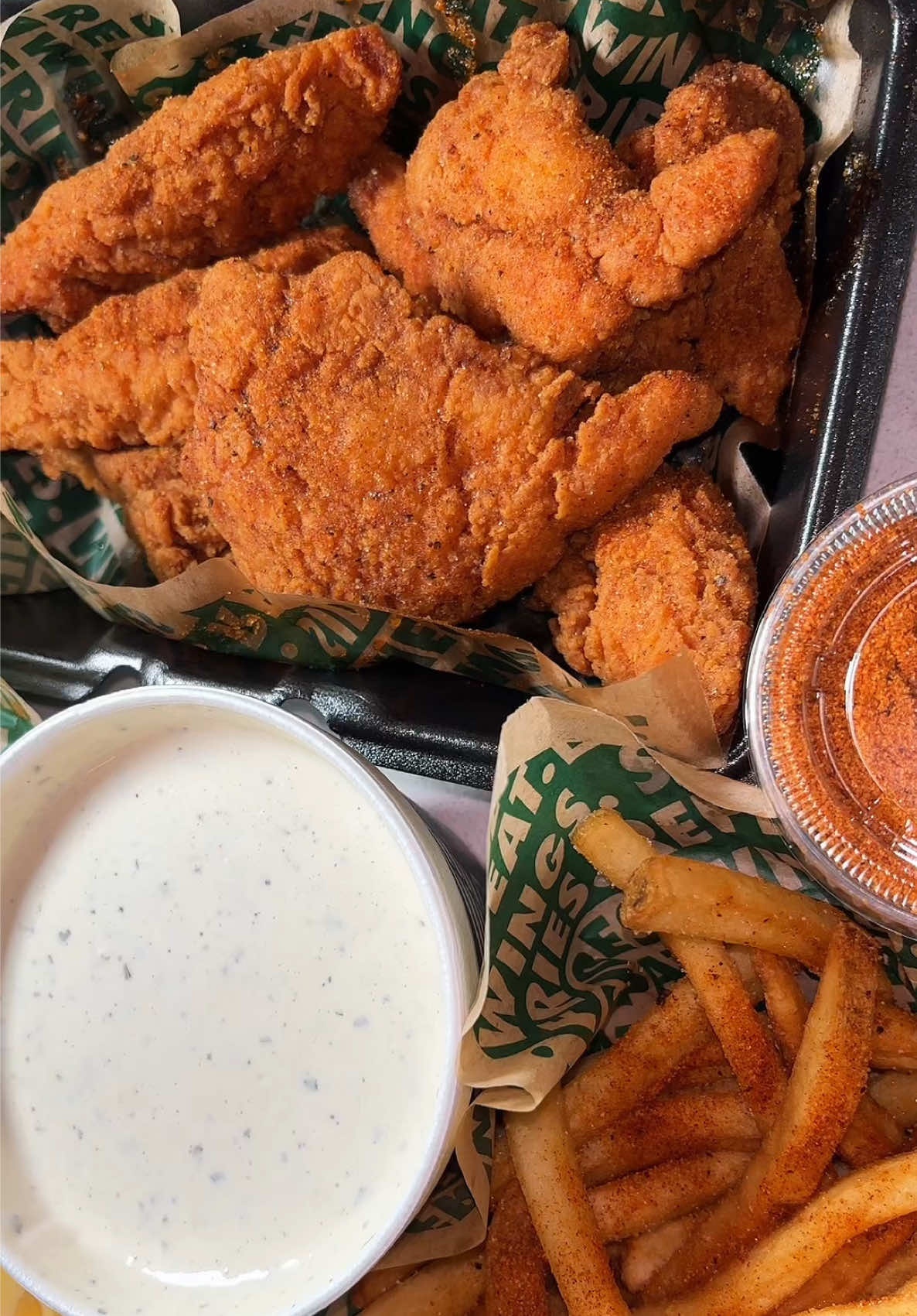 TikTok post by @shelby.eating for Wingstop. Caption reads: wingstop hot honey ranch, would you try it?....