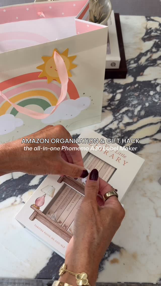 Instagram post by @laurenashleyhansen for Phomemo. Caption reads: Amazon Ultimate Organization Hack 🤩 comment LABEL....