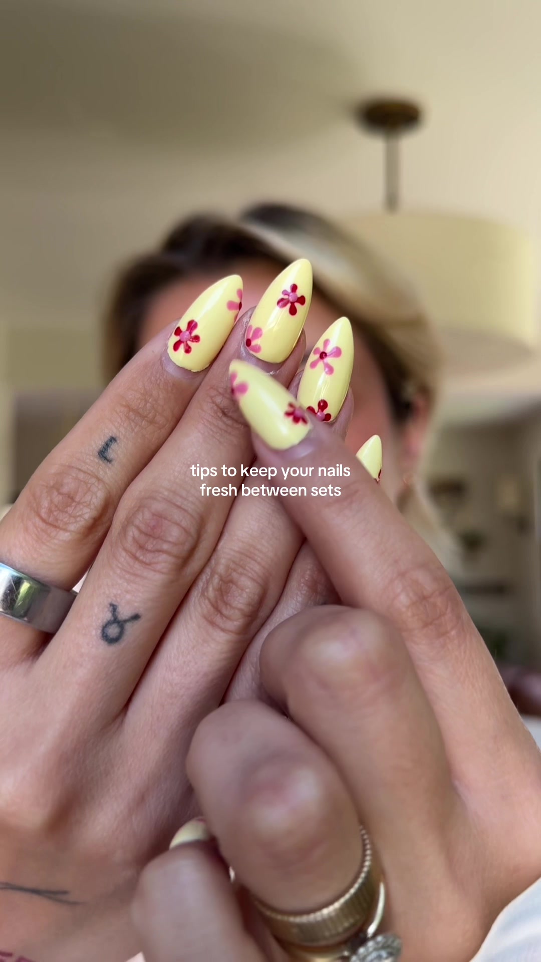 TikTok post by @saadiiie for JUNOCO. Caption reads: trimmed cuticles and my @JUNOCO California nail....