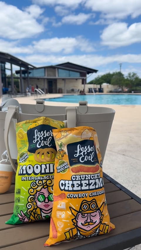Instagram post by @thedailyammie for LesserEvil Snacks. Caption reads: [...] the perfect pool snacks! Pickup....