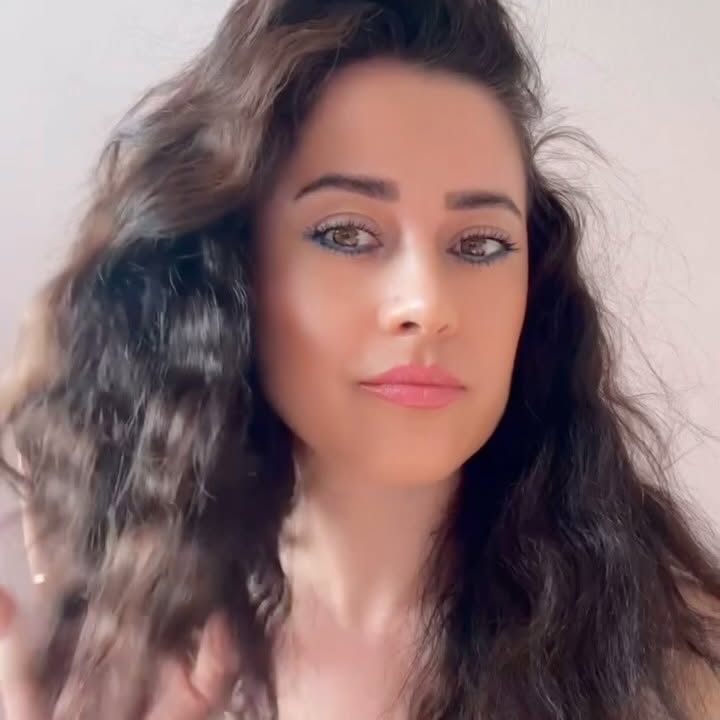 Instagram post by @den.ic.life for Arganmidas. Caption reads: [...] my hair feels lately!
Been using the....