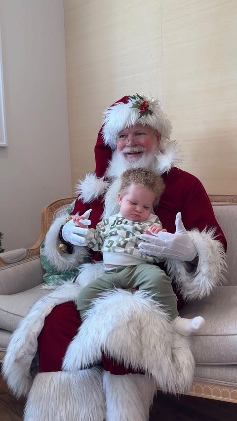 Instagram post by @linds.boone for Gerber Childrenswear. Caption reads: hanging out with santa in her @gerberchildrenswear....
