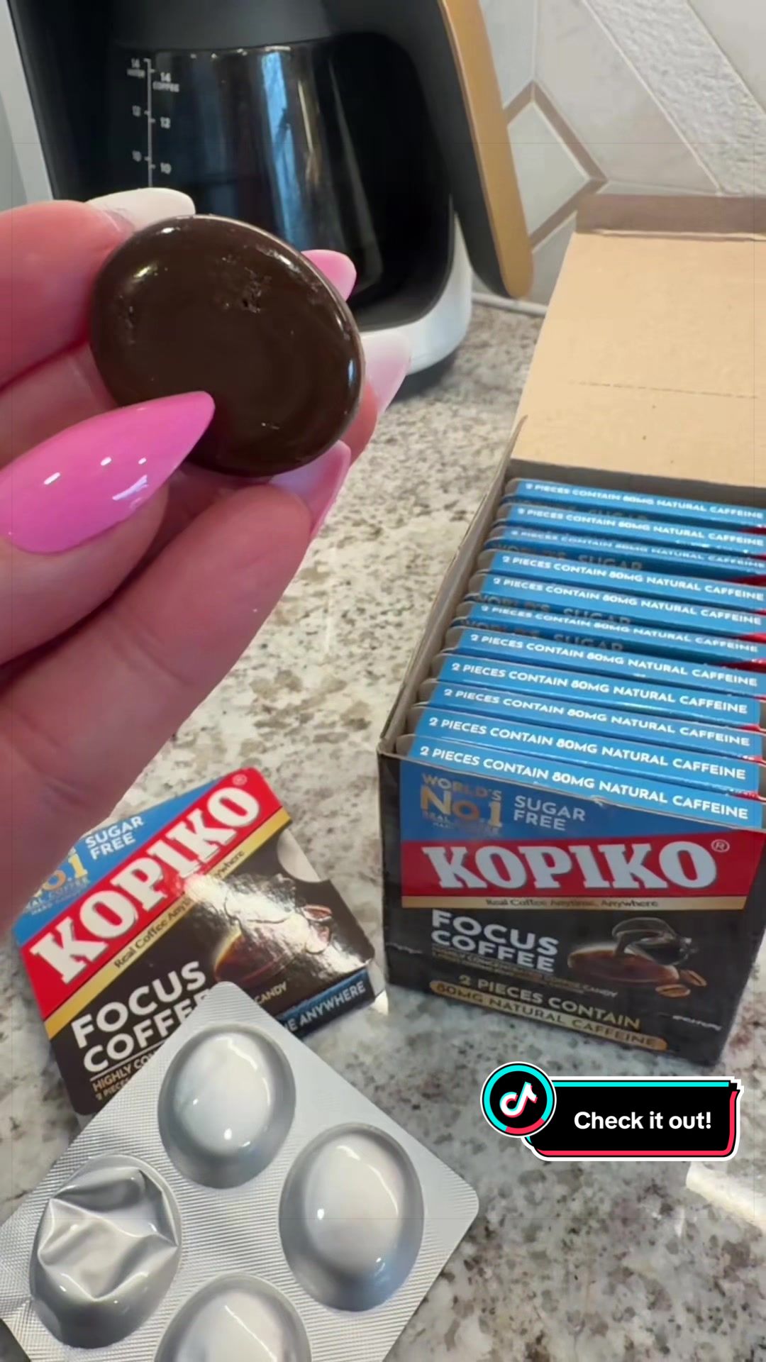TikTok post by @jadestikkytok for Kopiko USA. Caption reads: 🖤 Sugar-free coffee candy 🖤 Made with real....