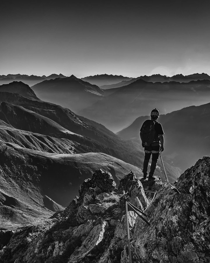 Instagram post by @blackmountainswhite for Helly Hansen. Caption reads: My preferred time to take photos in peace and....