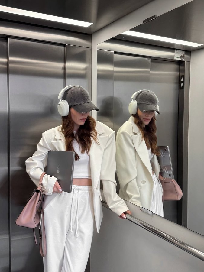 Instagram post by @torshina_lina for Sudio. Caption reads: When tech meets style — my new @sudio earbuds are....