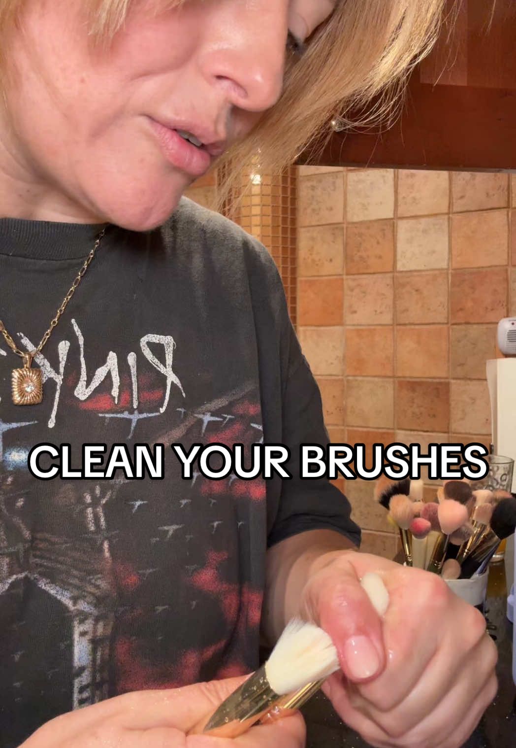 TikTok post by @katiejanehughes for Spectrum Collections. Caption reads: How to clean your brushes! @Spectrum Collections....
