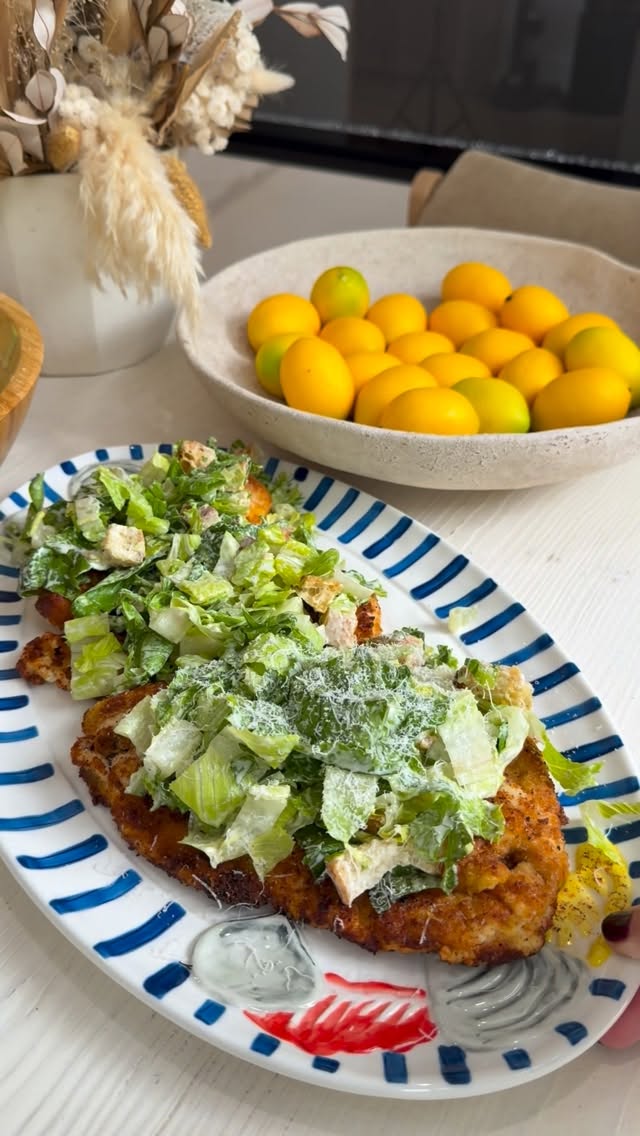 Instagram post by @everything_delish for Victorinox. Caption reads: Crispy chicken cutlets topped with fresh Caesar....