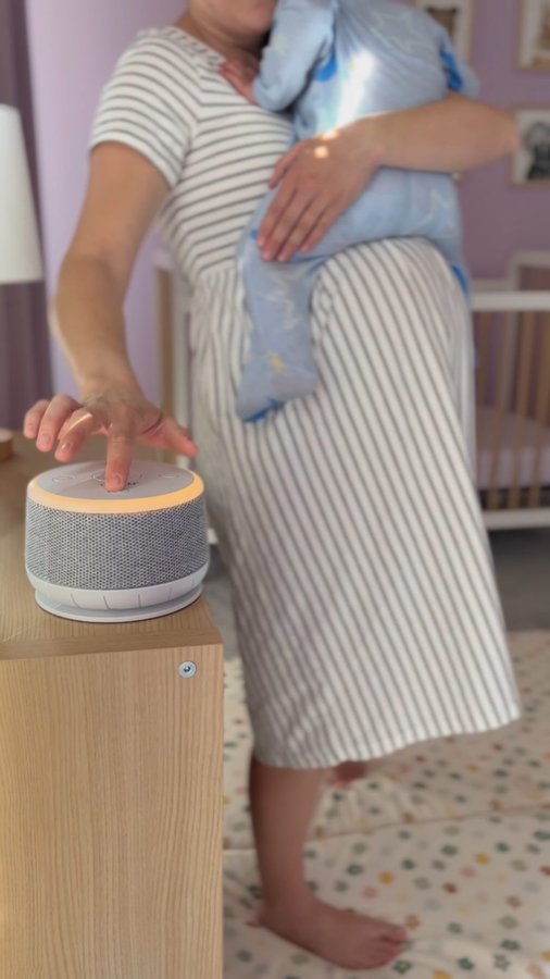 Instagram post by @mommaandmeow for Yogasleep. Caption reads: [...] the entire family. The Dohm Nova by....