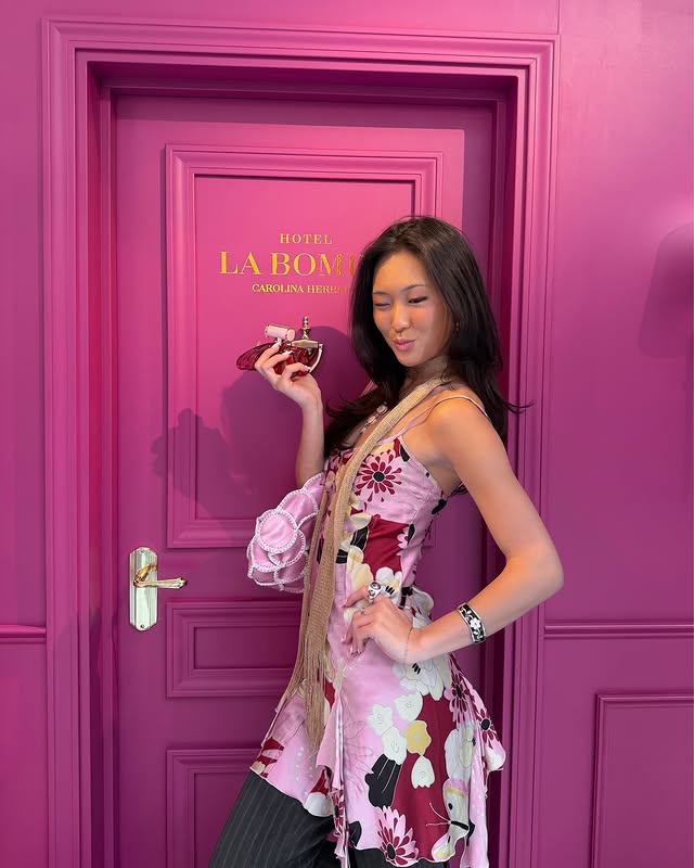 Instagram post by @maddy_kim for Carolina Herrera. Caption reads: a fragrance for the it-girl 💋💋 @carolinaherrera....