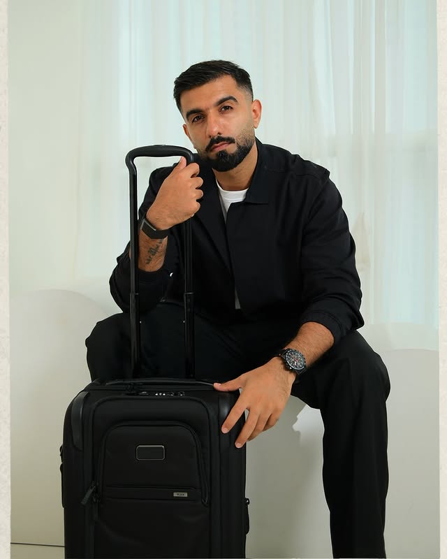 Instagram post by @mr.mnv for TUMI. Caption reads: [...] just makes every journey better 🥰🖤....
