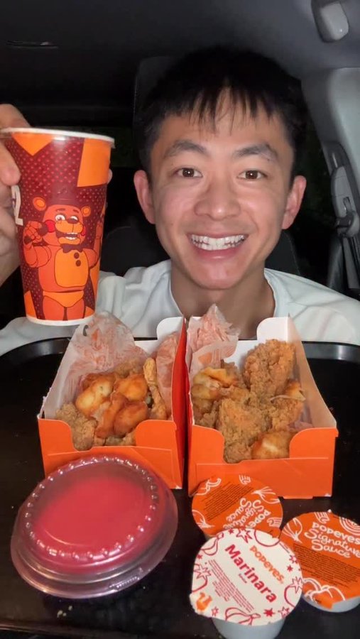 Instagram post by @thejcheneats for Popeyes. Caption reads: Trying @popeyes NEW Garlic Parmesan Tenders 🔥.