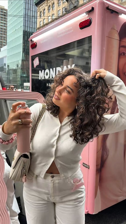 Instagram post by @tondreannaesquilin for MONDAY Haircare. Caption reads: NYC pop-up with @mondayhaircare 💕

yesterday I....