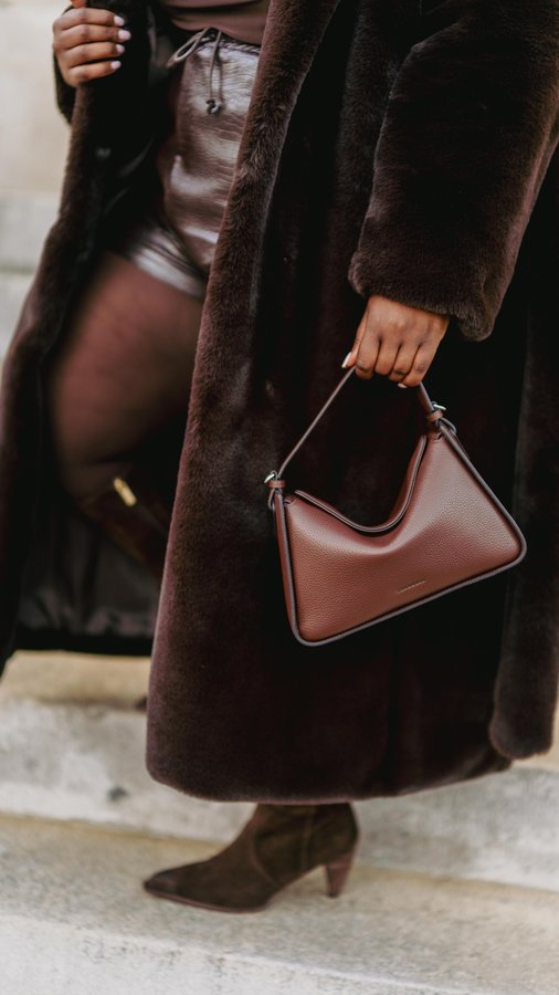 Instagram post by @musingsofacurvylady for Vince Camuto. Caption reads: Bringing this one back because @vincecamuto makes....