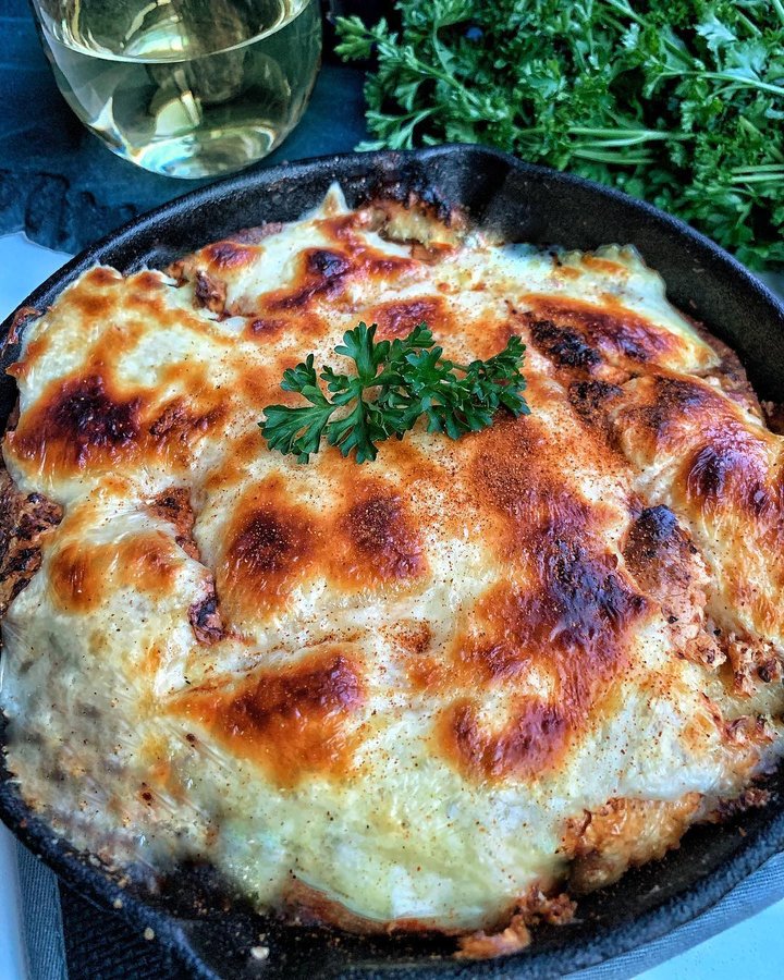 Instagram post by @losangeles_eats for Foodie Tribe. Caption reads: WINE LOVER'S GRATIN ("Winzer Gratin") 🍞🍷🧀 is a....