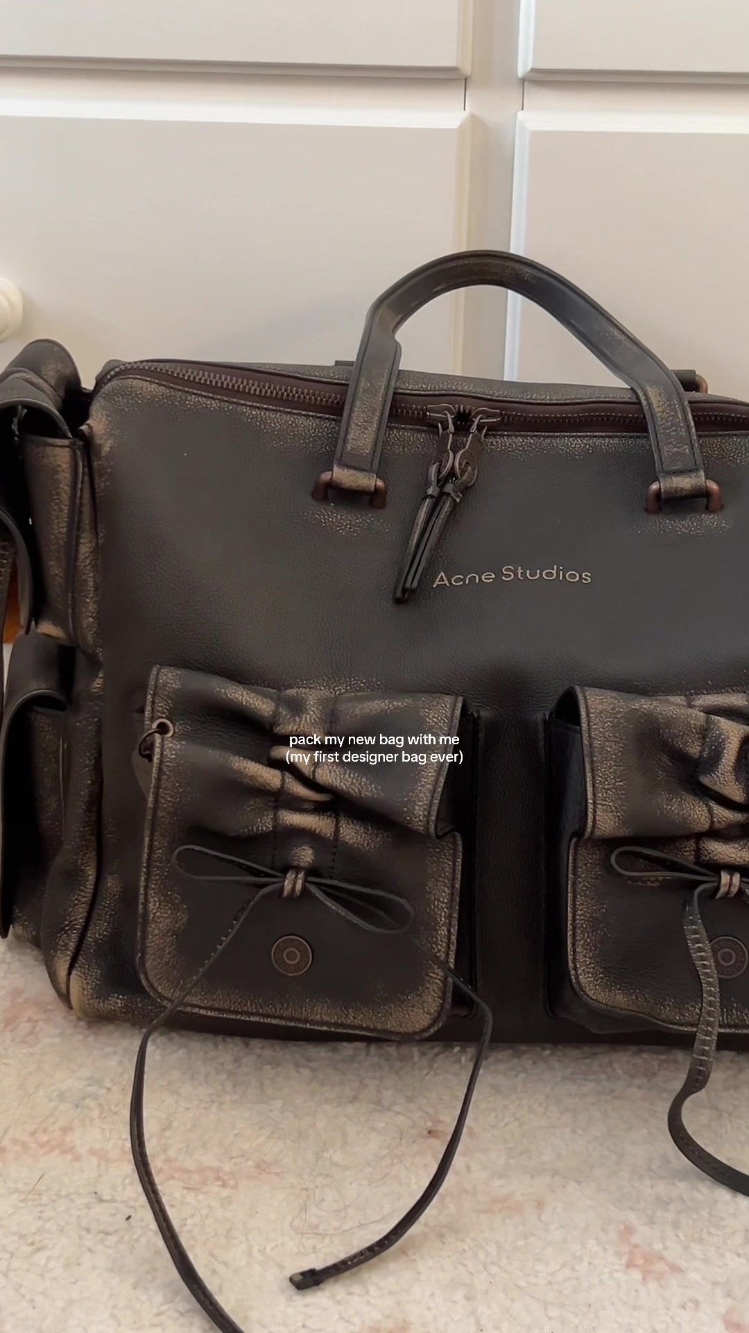 TikTok post by @rxyejin for Acne Studios. Caption reads: Best bday gift ever 🤍⭐️ @acnestudiosofficial .