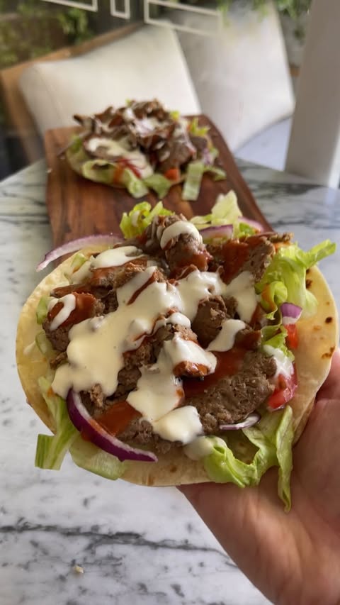 Instagram post by @bites.by.angie for Mingle Seasoning. Caption reads: Viral Doner Kebab Tacos 🌮🥙 who doesn’t love a....