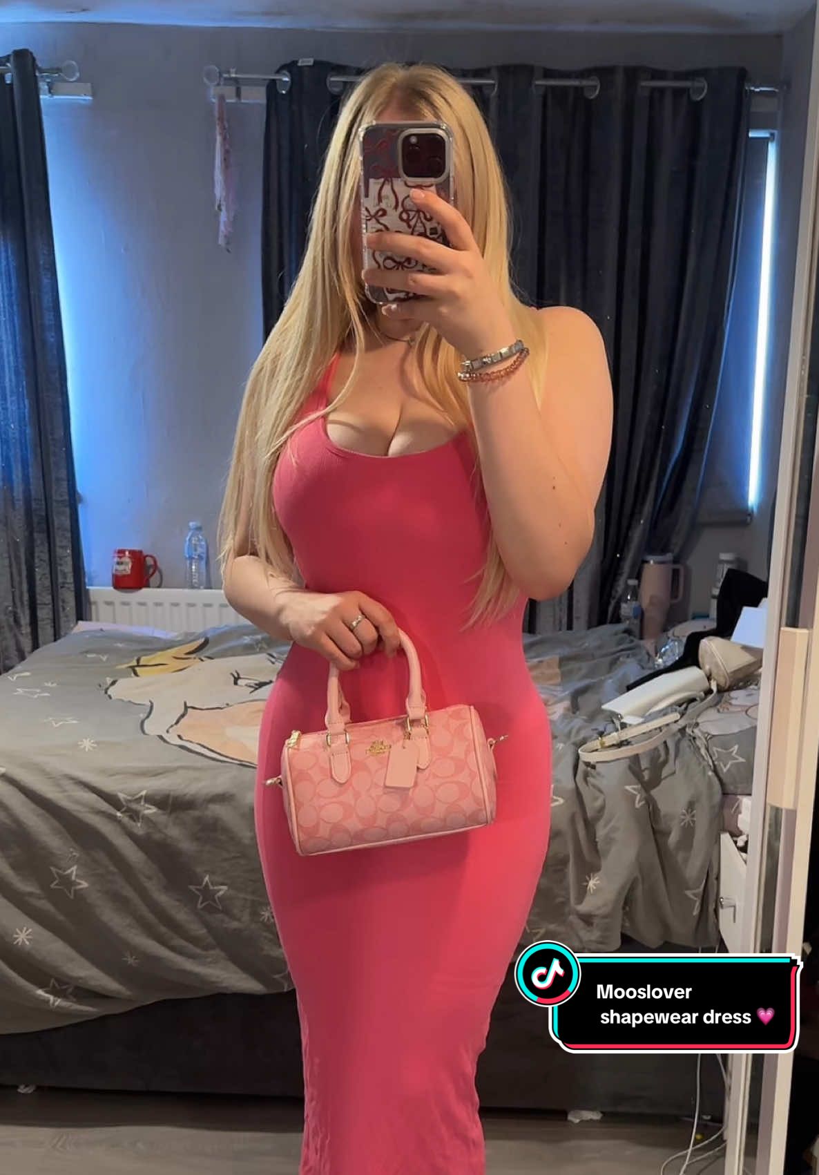 TikTok post by @katienicole15x for MOOSLOVER. Caption reads: This mooslover dress has me in a chokehold 😍💗....