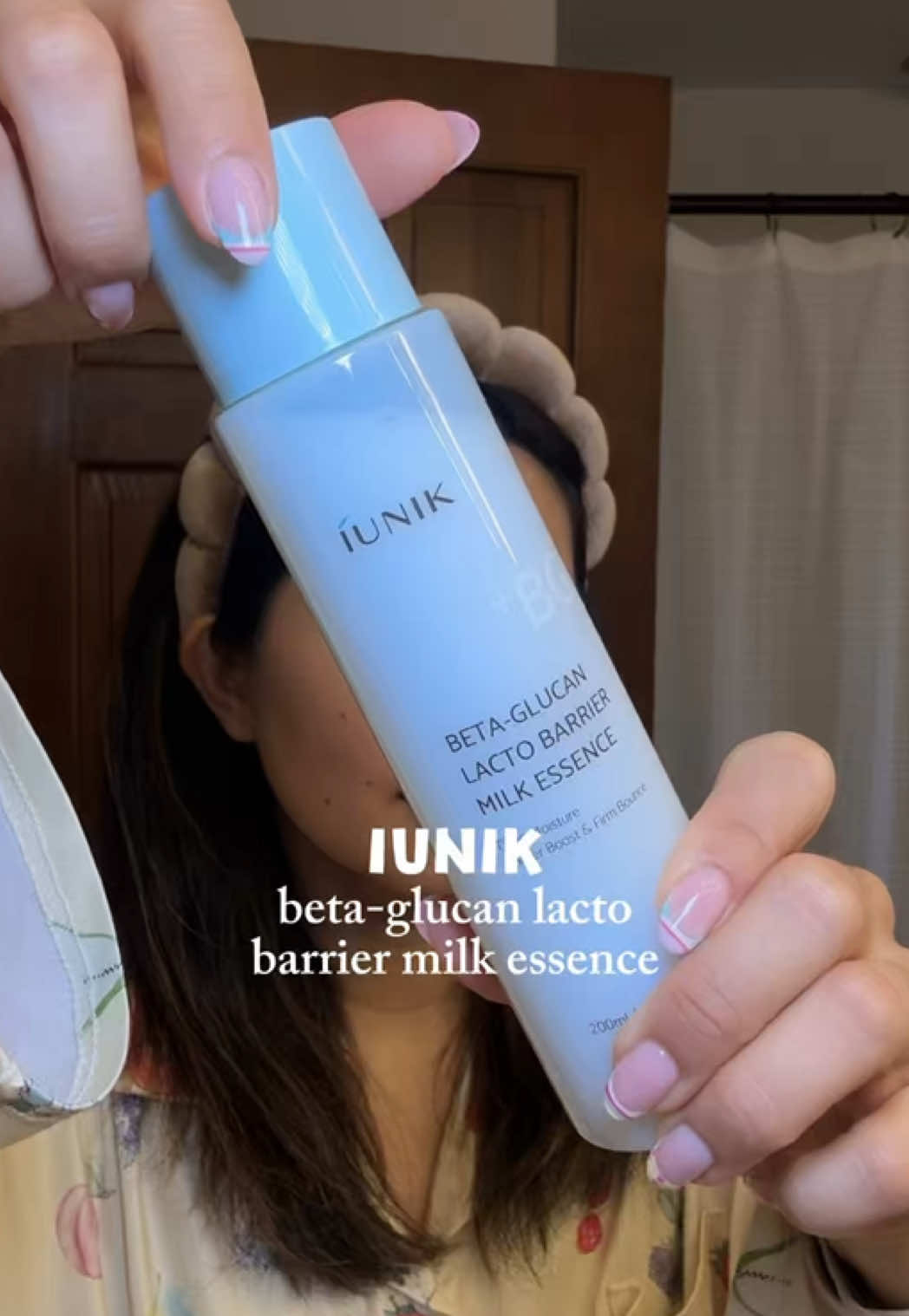 TikTok post by @cindyy_yang for IUNIK. Caption reads: This milk essence from @IUNIK is now a staple in....