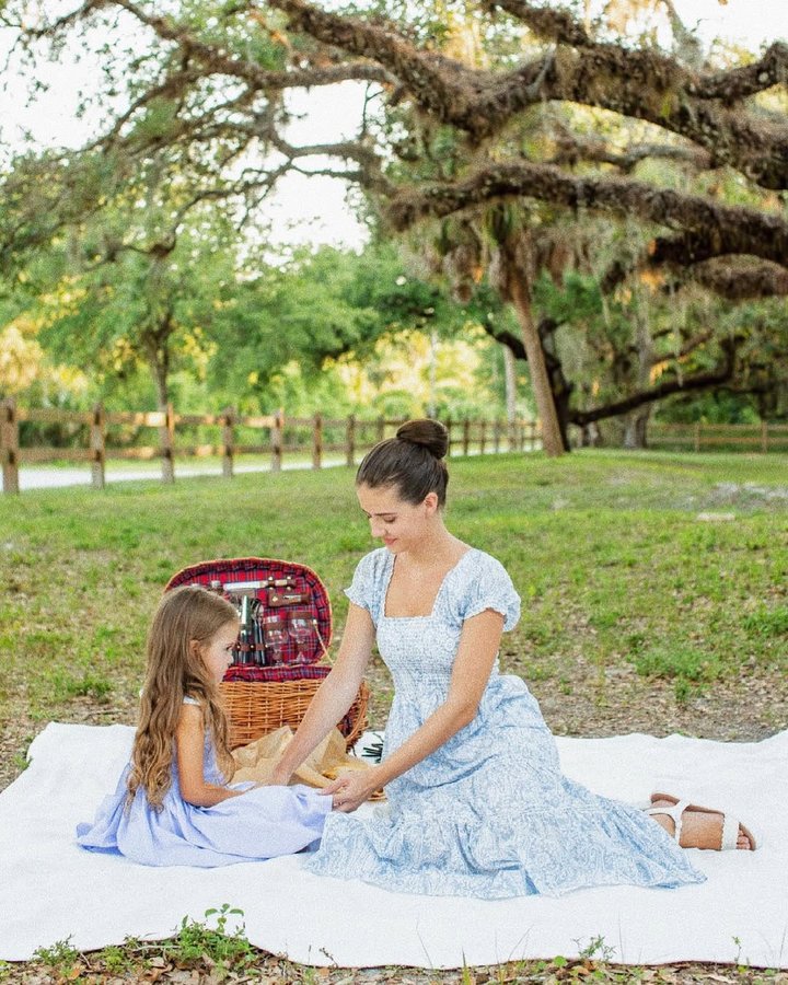 Instagram post by @irinaviktoryivna for Few Moda. Caption reads: Darling @childrensalon smocked dress is perfect....