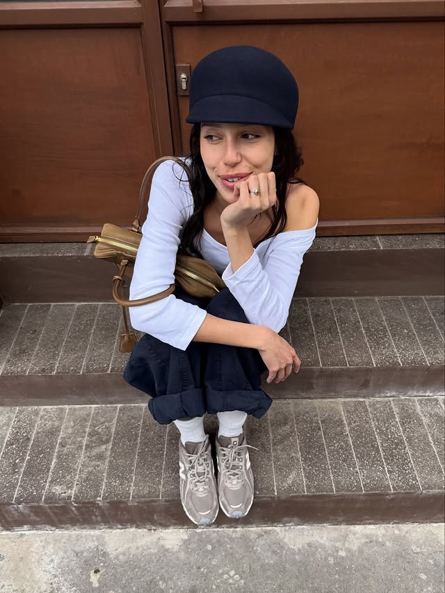 Instagram post by @maina for Courir. Caption reads: [...] 🧳 in my @newbalancelifestyle 204L @courir.