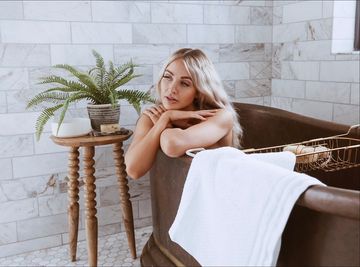 Instagram post by @caraloren for The Home Edit. Caption reads: [...] my bathroom today! I used the new....