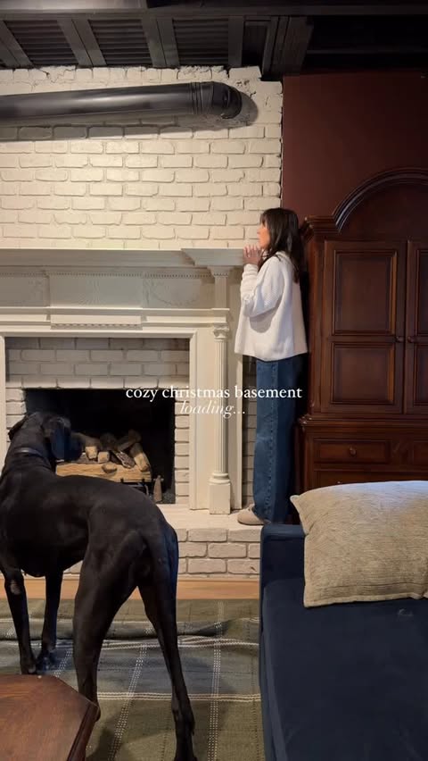 Instagram post by @prettyinthepines for Lovesac. Caption reads: Turning our basement into a cozy Christmas....