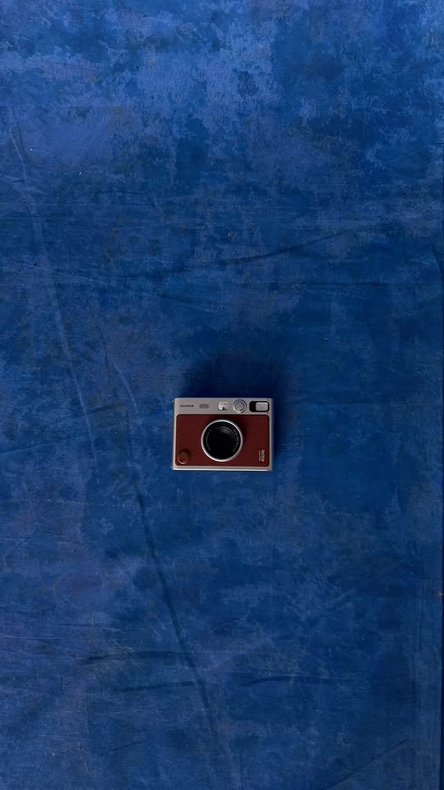 Instagram post by @skylarmarshai for Fujifilm Instax North America. Caption reads: played in prints and primaries with my instax mini....