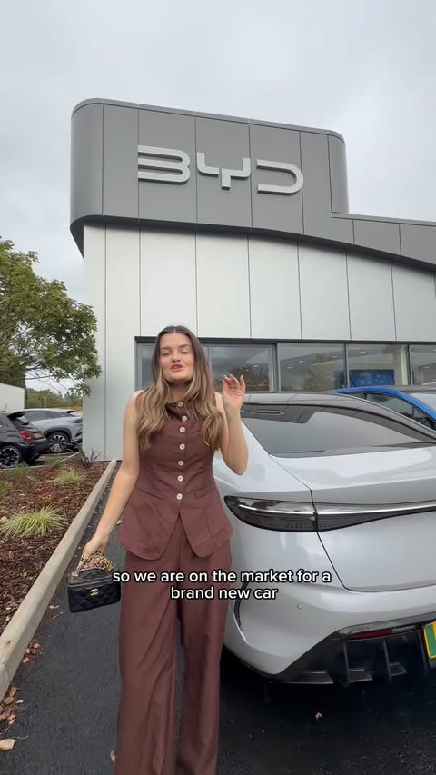 Instagram post by @laurennyland for BYD. Caption reads: Family car shopping with BYD 🚗🤍 Come along with....