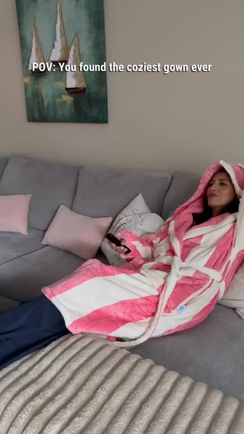 Instagram post by @cinthiacjensen for The Oodie. Caption reads: [...] 👇 Comment GOWN for link 🛍️ #TheOodie....