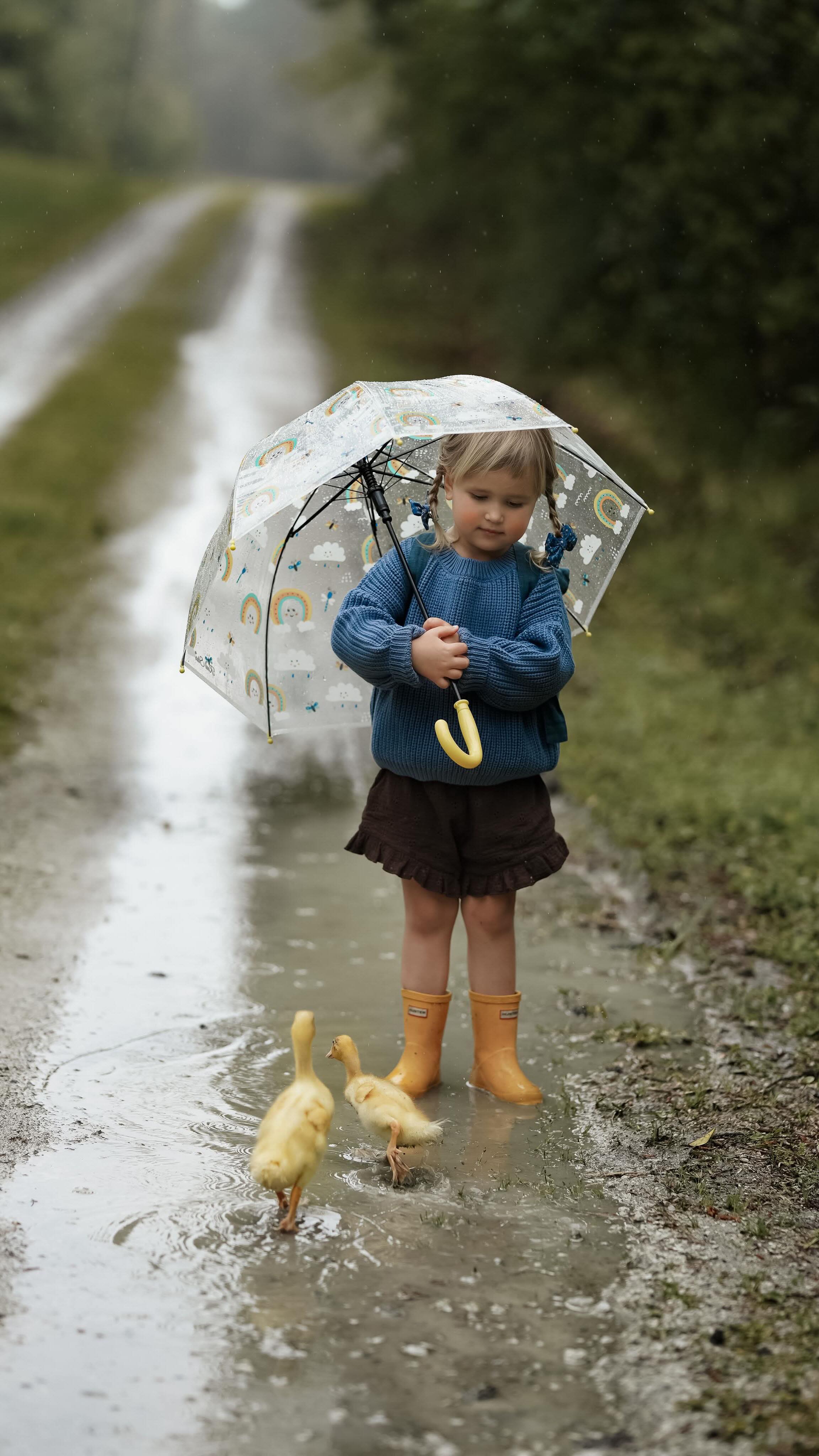 Instagram post by @ksenia_belanger for Hunter Boots. Caption reads: More dancing in the April rain ☔️ 🐥 👧 🐥.