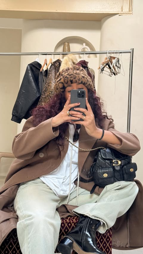 Instagram post by @taylasnts for Coach. Caption reads: This is your sign to shop @coach on @revolve!....