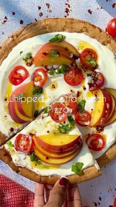 Instagram post by @flavorsnlife for Banza. Caption reads: Whipped Ricotta Peach Pizza. Full recipe below ⬇️....