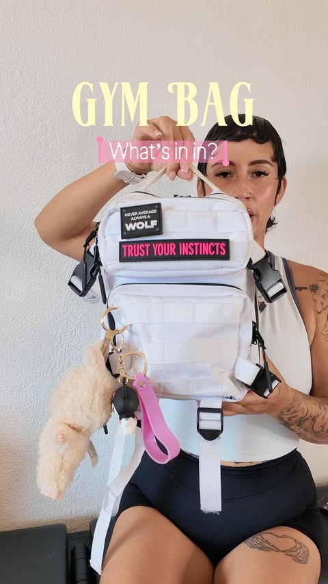Instagram post by @sabbrinaaa_ for Wolfpak. Caption reads: What’s in my @wolfpak.official gym bag✨👀....