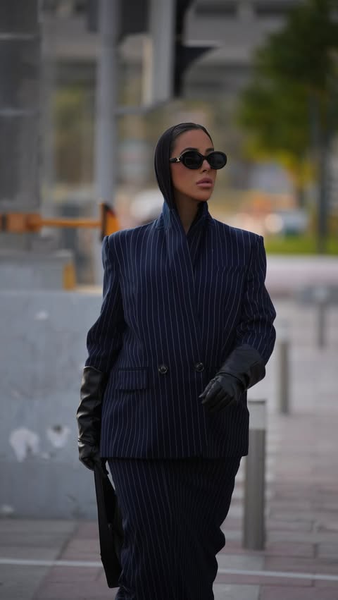 Instagram post by @amanyfawzi for Club L London. Caption reads: Sharp. Sophisticated. @clubllondon_me .
#Ad.