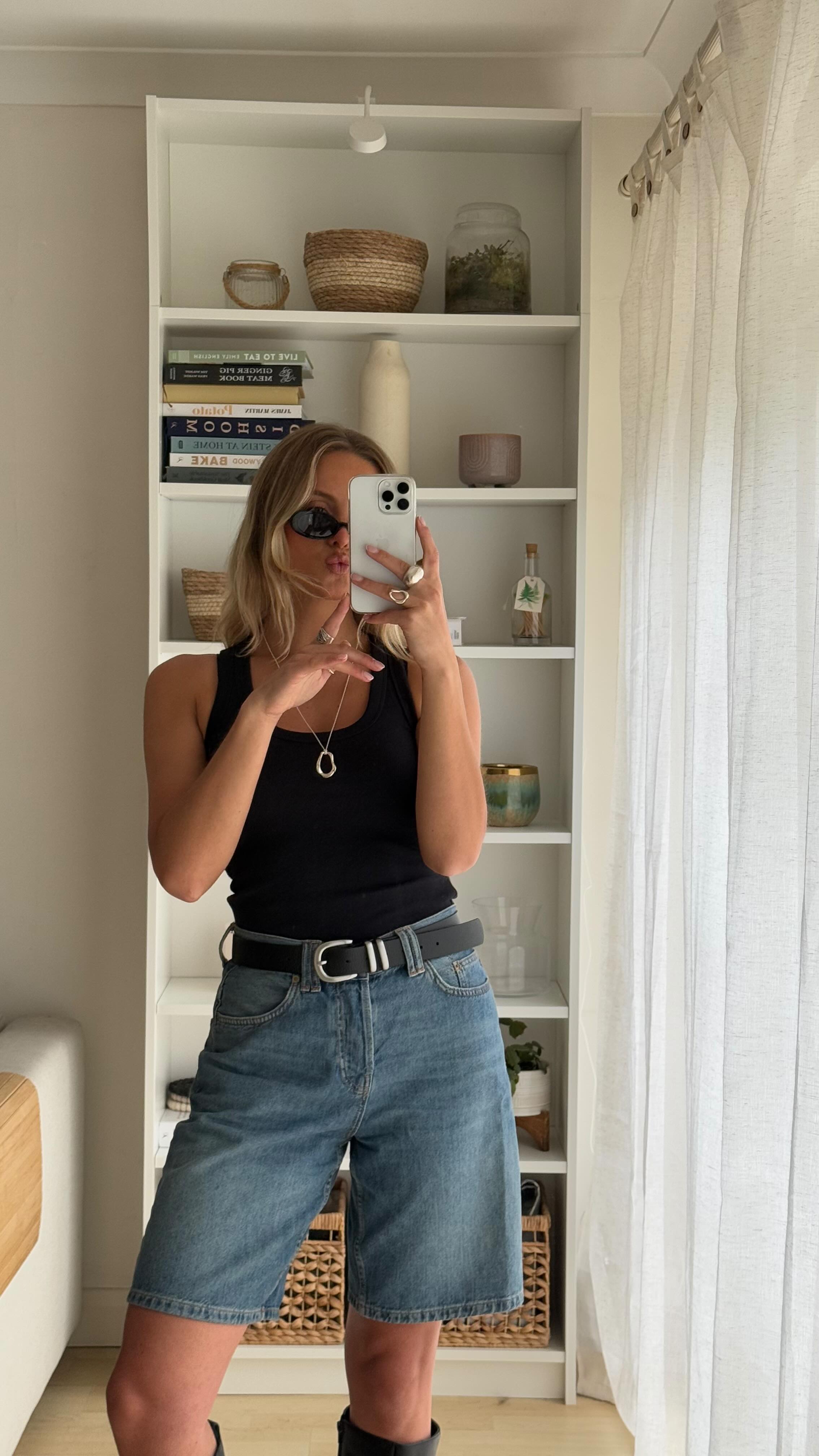 Instagram post by @marthawr for THOMAS SABO. Caption reads: Pinterest made me do it ☔️🖤👖

Jorts, long boots,....