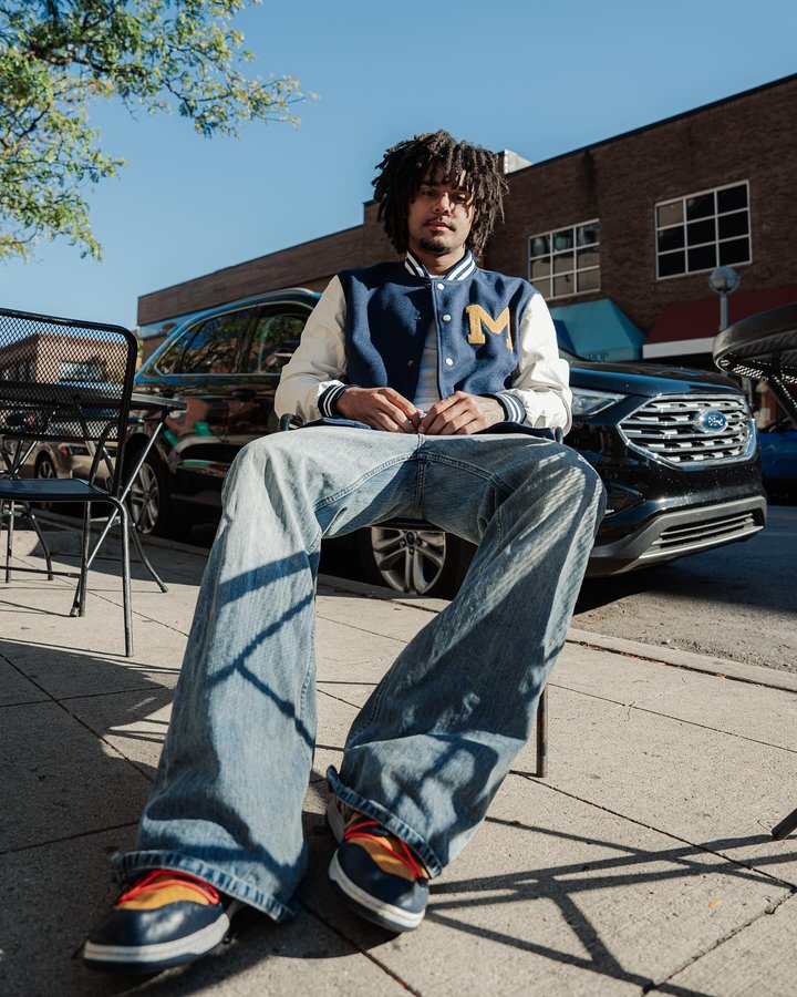 Instagram post by @elllio for Homefield Apparel. Caption reads: @homefieldapparel didn’t miss with the new Varsity....