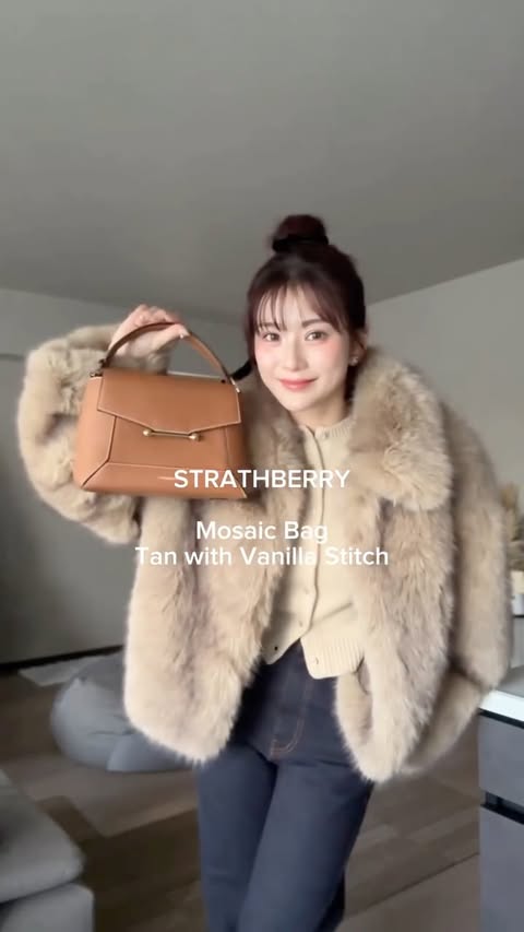 Instagram post by @kanako228m for Strathberry. Caption reads: [...] 
outer @leinwande_official 
bag @strathberry....