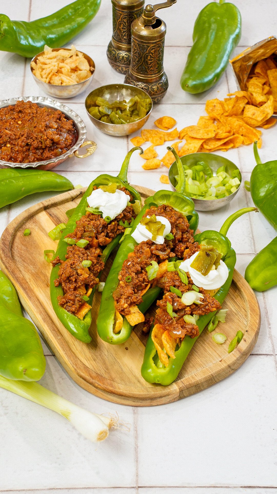 Instagram post by @coupleinthekitchen for H-E-B. Caption reads: New Mexico Green Chile Frito Pie 🤤 When Texas....
