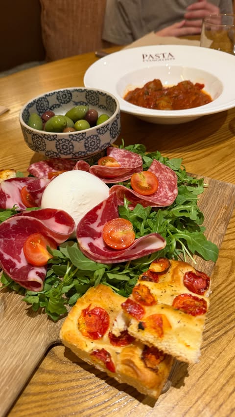 Instagram post by @whoisthatlondonmum for Pasta Evangelists. Caption reads: A festive feast with the family at Pasta....