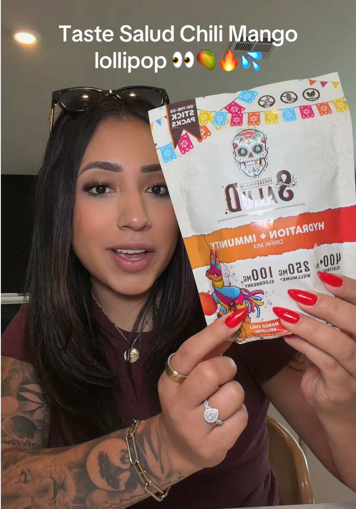 TikTok post by @modernmexicancasita for Taste Salud. Caption reads: [...] lollipop is SO GOOD 🥭🔥💦 @Taste Salud....