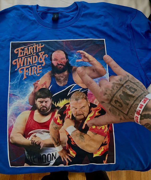 Instagram post by @greatestwrestlingcollection for TeePublic. Caption reads: [...] the day for throwback Thursday! 🌎💨🔥....