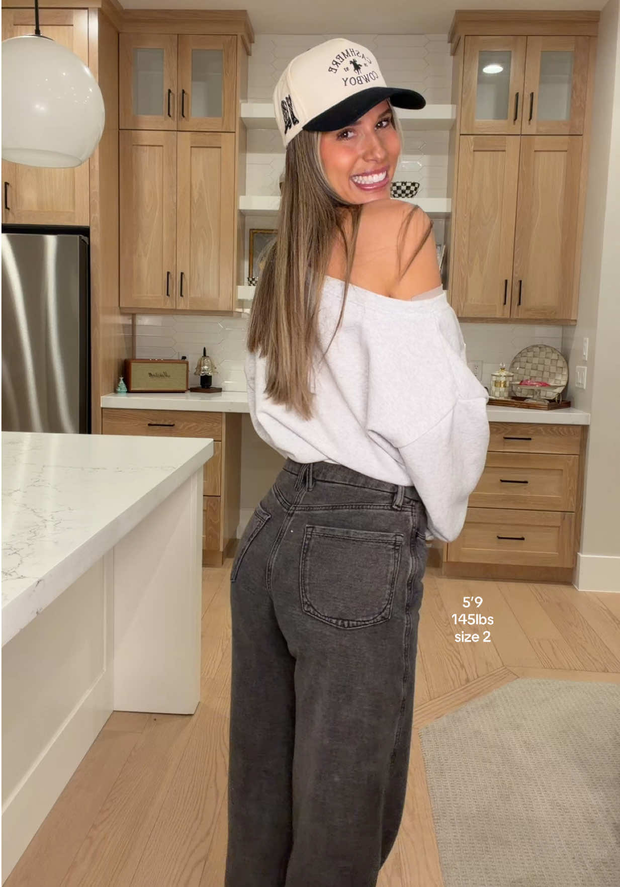 TikTok post by @chamley_teaches for GOOD AMERICAN. Caption reads: ILY @GOOD AMERICAN FOR THESE 🖤🖤 #jeans [...].