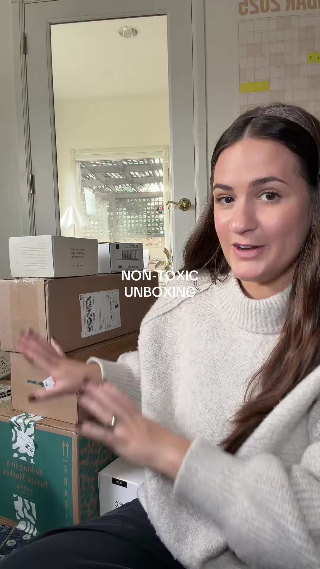 TikTok post by @karlyalane_ for OSEA Malibu. Caption reads: So many goodies #unboxing #prunboxing @momcozy....